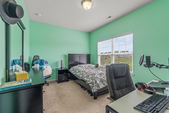 bedroom with baseboards, carpet flooring, and visible vents