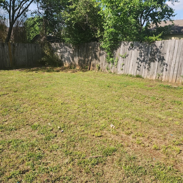 view of yard with a fenced backyard