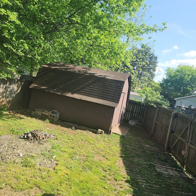 view of shed with a fenced backyard