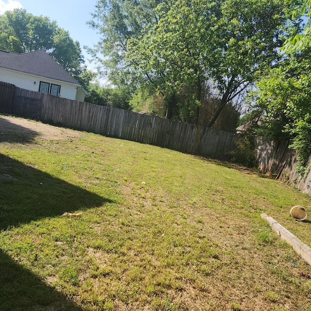 view of yard with a fenced backyard