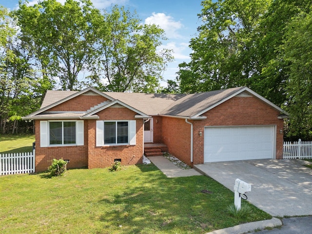 view of front of home with concrete driveway, a garage, fence, and a front lawn