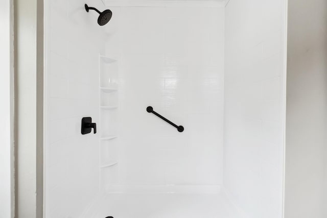 bathroom with a tile shower
