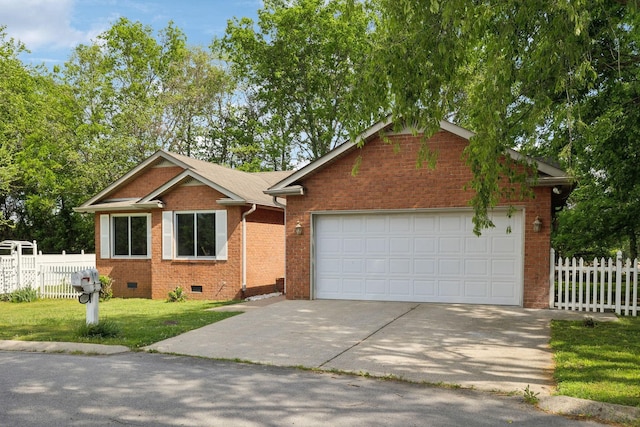 view of front of property featuring fence, concrete driveway, a front lawn, and brick siding