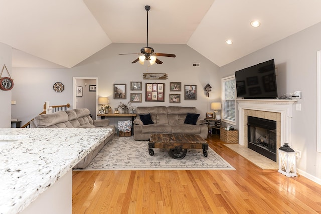 1137 Stillwood Dr, Clarksville, TN 37042 - living area featuring a ceiling fan, light wood-style flooring, a tile fireplace, lofted ceiling, and recessed lighting