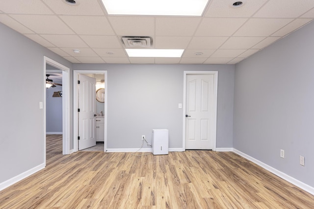 1137 Stillwood Dr, Clarksville, TN 37042 - unfurnished room featuring light wood finished floors, baseboards, and a drop ceiling