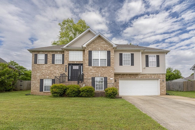 1137 Stillwood Dr, Clarksville, TN 37042 - bi-level home with an attached garage, concrete driveway, and brick siding