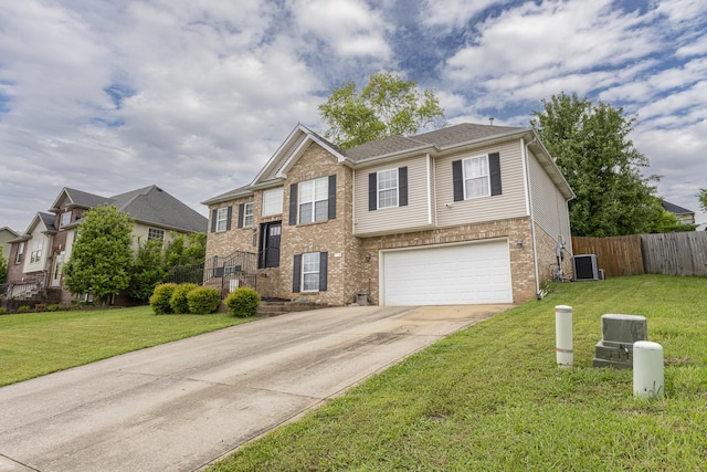 1137 Stillwood Dr, Clarksville, TN 37042 - view of front of property featuring cooling unit, driveway, an attached garage, and brick siding