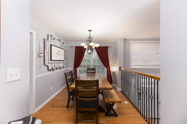1137 Stillwood Dr, Clarksville, TN 37042 - dining space with a chandelier, light wood-type flooring, and baseboards