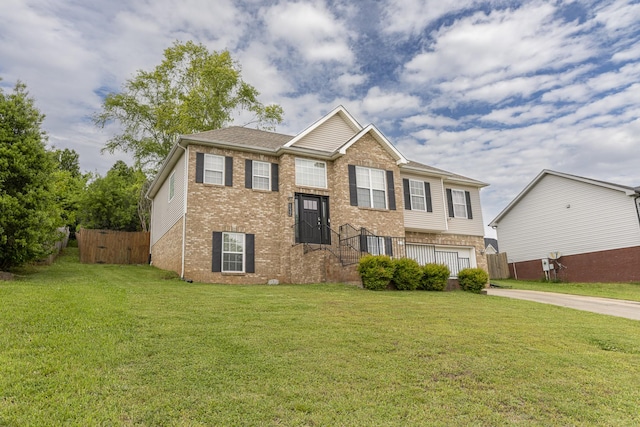 1137 Stillwood Dr, Clarksville, TN 37042 - split foyer home with brick siding, concrete driveway, and an attached garage