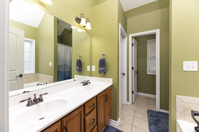 1137 Stillwood Dr, Clarksville, TN 37042 - bathroom with tile patterned floors, a garden tub, double vanity, and baseboards