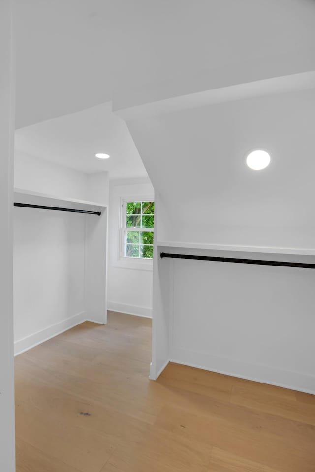 spacious closet with light wood-style floors