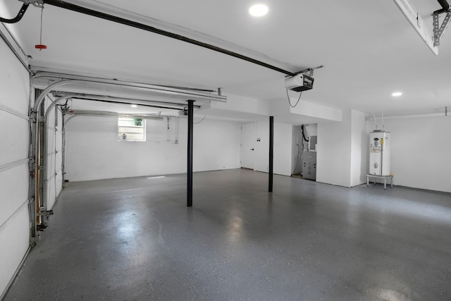 garage with water heater and a garage door opener