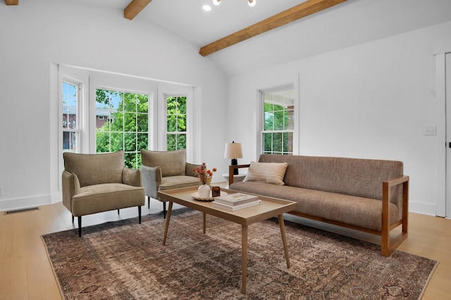 living room with vaulted ceiling with beams, recessed lighting, wood finished floors, and visible vents