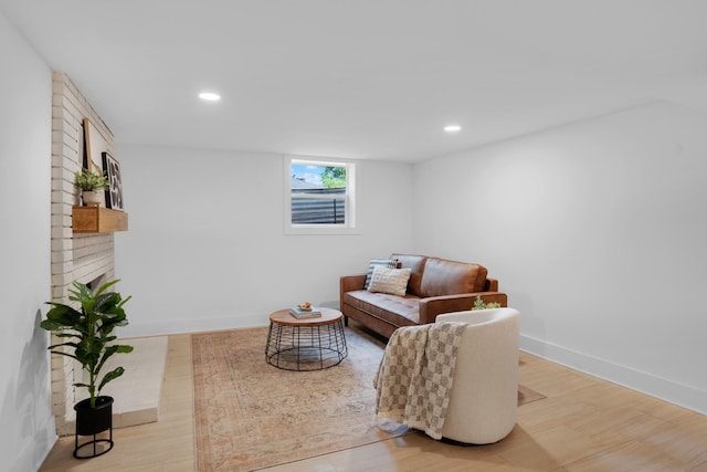sitting room with recessed lighting, baseboards, and light wood-type flooring