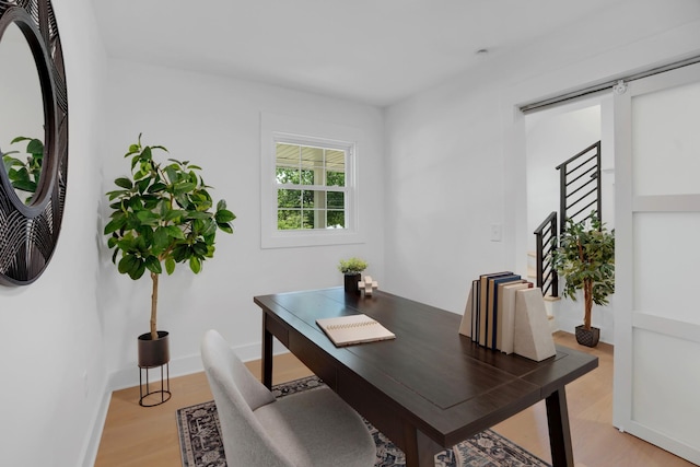 office with baseboards and light wood-type flooring