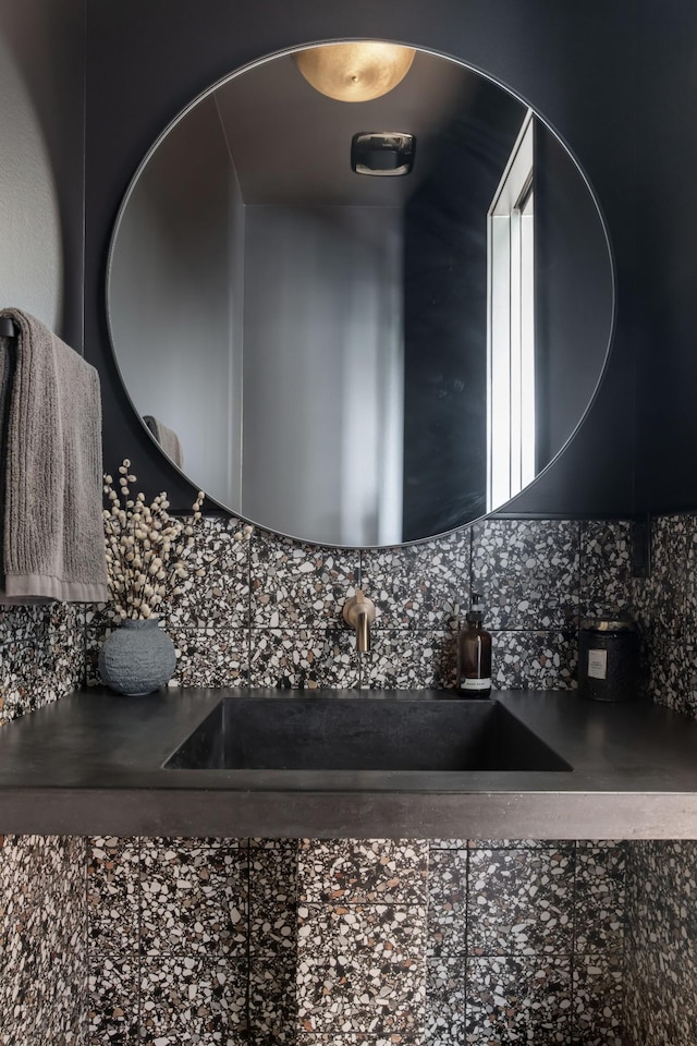 interior space featuring a sink and tasteful backsplash