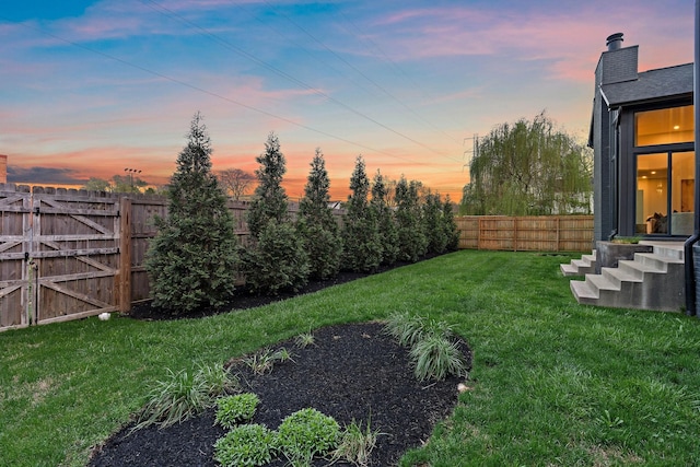 view of yard featuring a fenced backyard