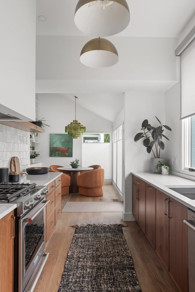 kitchen featuring light countertops, light wood-style flooring, and stainless steel appliances