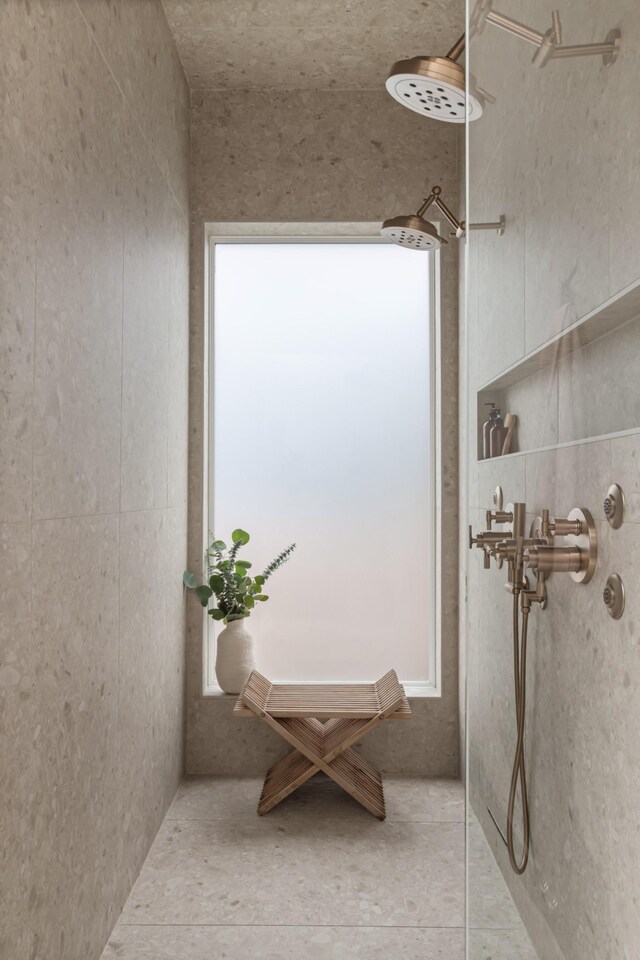 bathroom with a tile shower