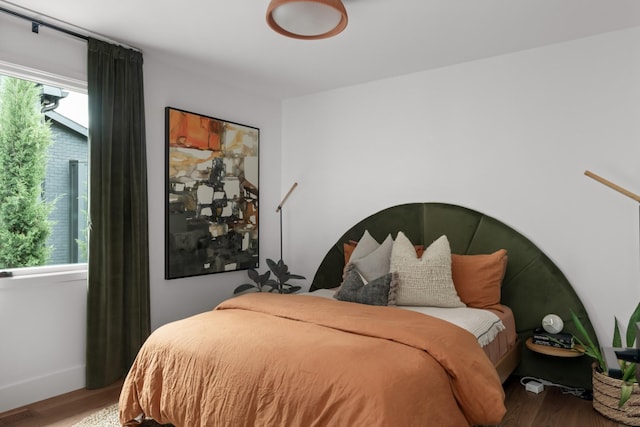 bedroom with wood finished floors