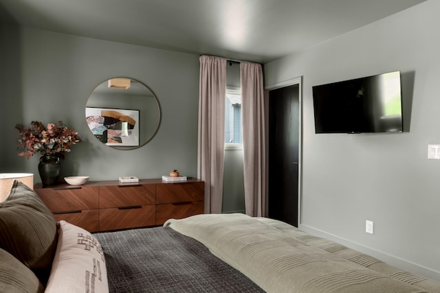 bedroom featuring baseboards