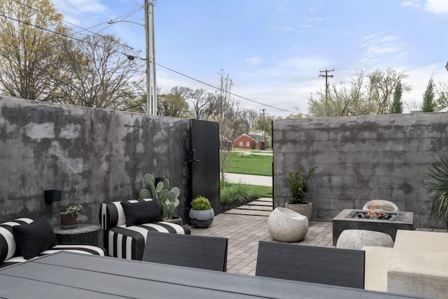 view of patio / terrace featuring a fire pit