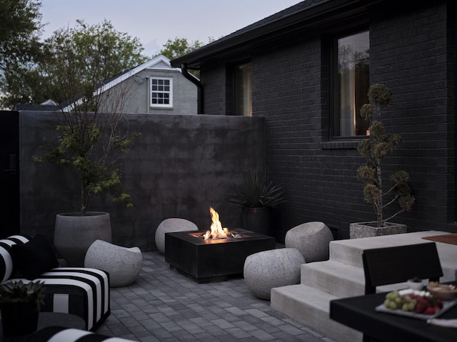 view of patio / terrace featuring an outdoor fire pit