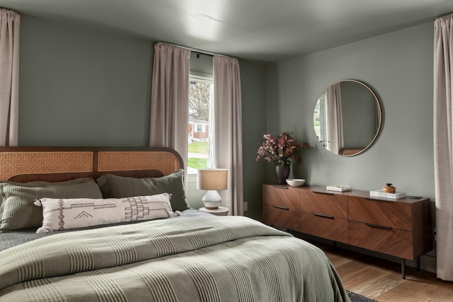 bedroom featuring wood finished floors