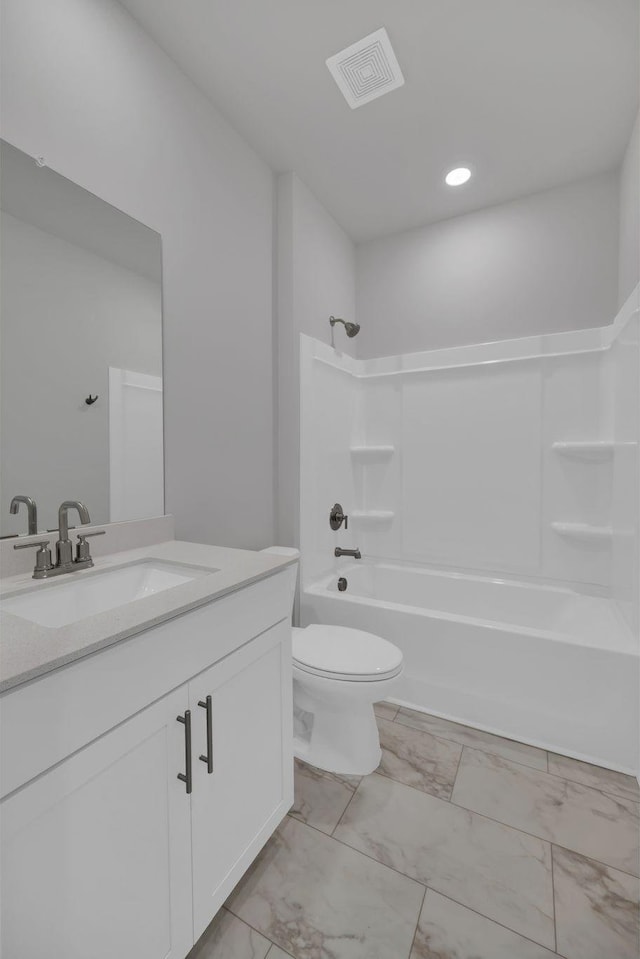 full bath featuring washtub / shower combination, vanity, toilet, marble finish floor, and visible vents