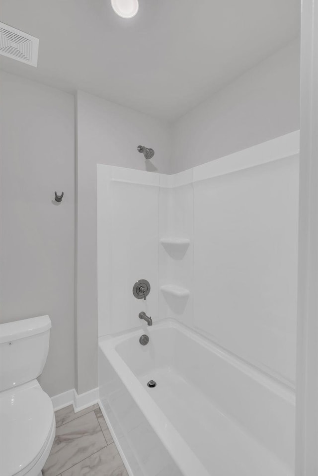 full bath featuring visible vents, marble finish floor, toilet, baseboards, and shower / bath combination