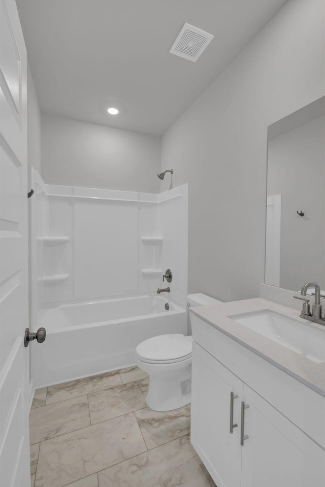 bathroom with shower / tub combination, vanity, toilet, marble finish floor, and visible vents