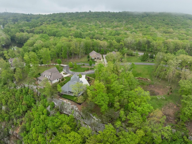 drone / aerial view featuring a forest view