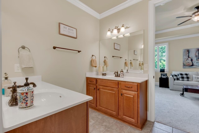 full bath with a ceiling fan, tile patterned flooring, two vanities, a sink, and ornamental molding
