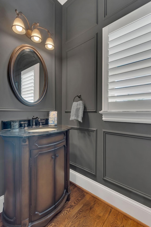 bathroom featuring vanity and wood finished floors