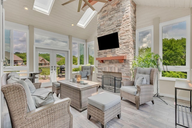 sunroom / solarium with french doors and a skylight