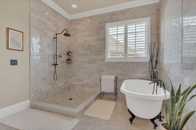 full bathroom with a freestanding bath, a tile shower, tile patterned floors, tile walls, and ornamental molding