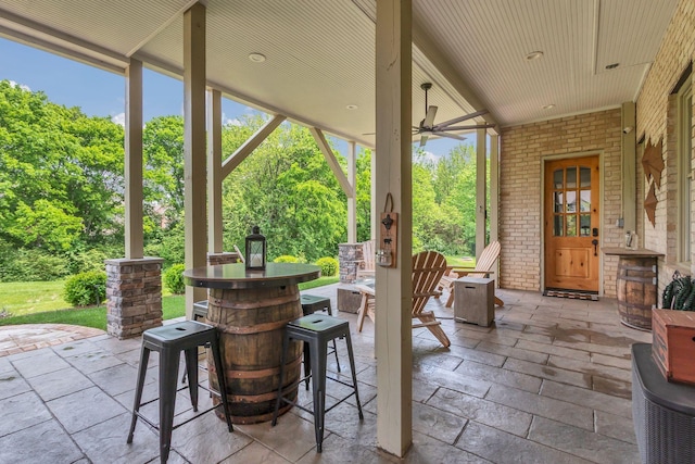 view of patio featuring ceiling fan