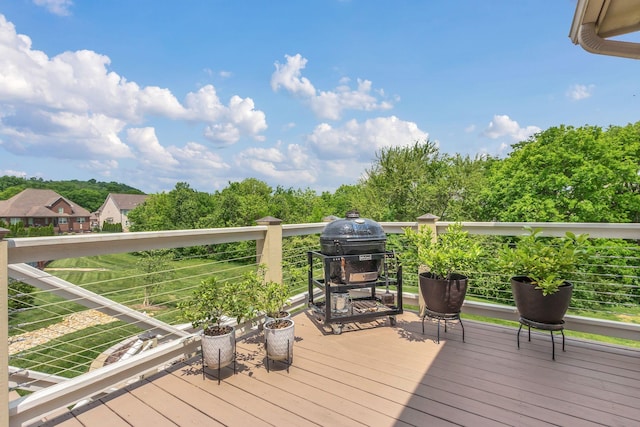 deck featuring a grill