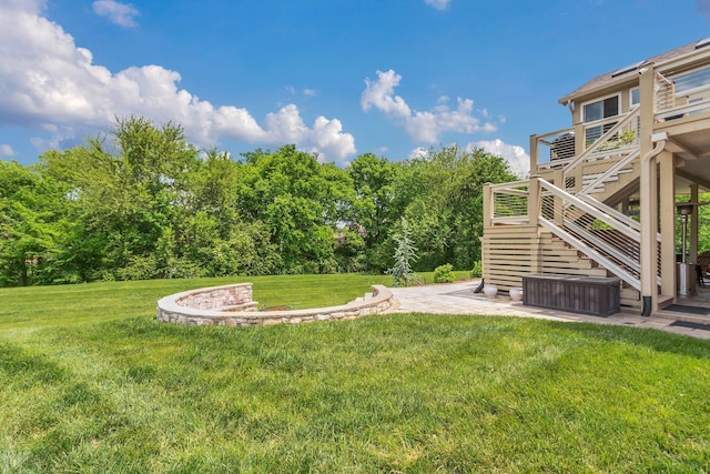 view of yard featuring a patio, stairway, and a deck