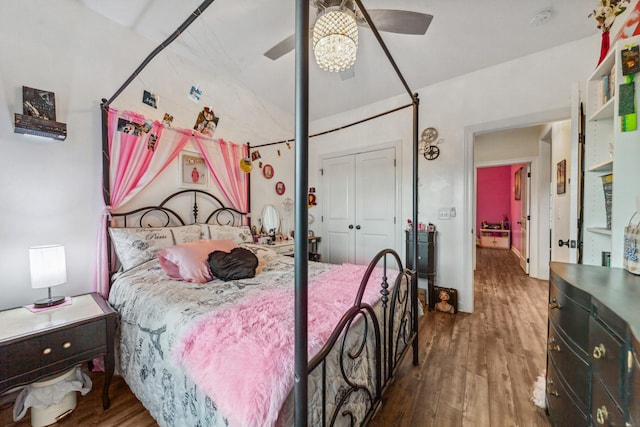 bedroom featuring a closet, wood finished floors, and ceiling fan