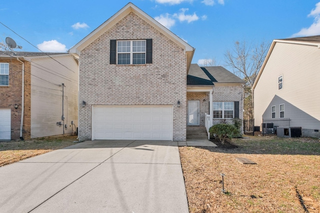 traditional home with a garage, concrete driveway, central AC, and brick siding