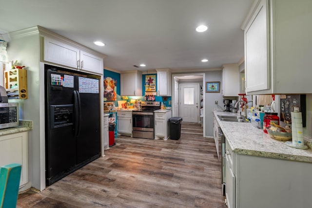 kitchen featuring a sink, stainless steel appliances, recessed lighting, and dark wood-type flooring