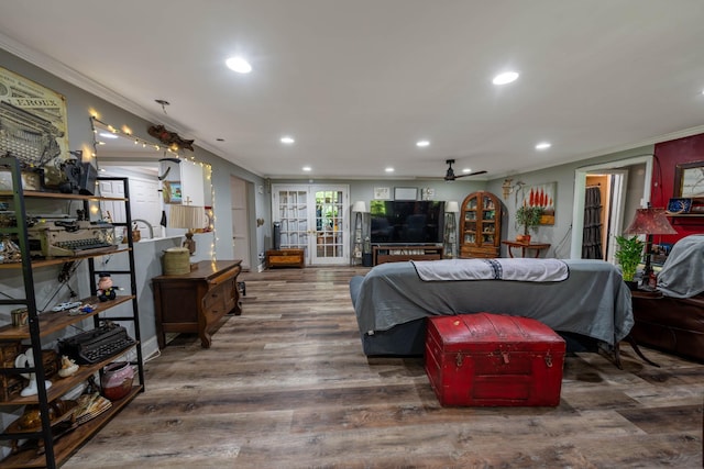 interior space with crown molding, recessed lighting, and wood finished floors