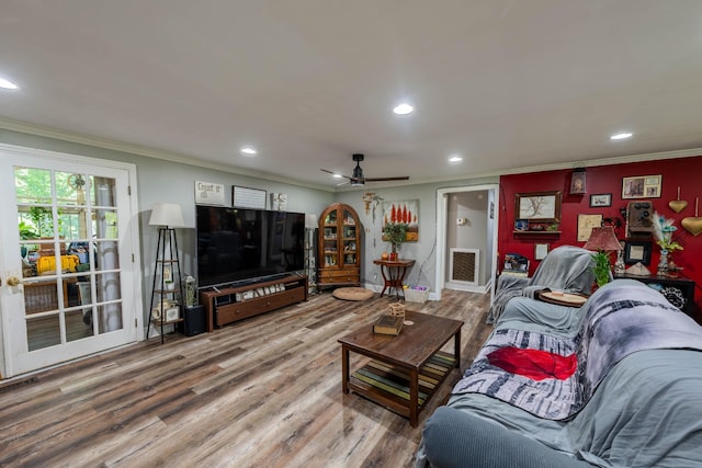 living area with recessed lighting, ornamental molding, ceiling fan, and wood finished floors