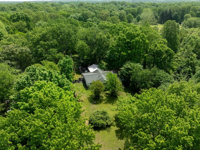 birds eye view of property featuring a wooded view