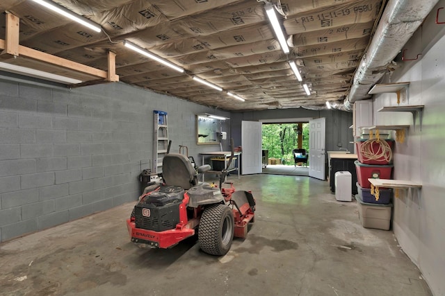 garage with concrete block wall