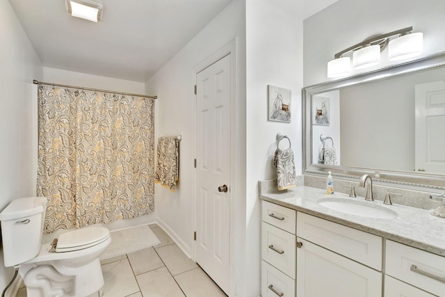 bathroom with vanity, toilet, a shower with curtain, and tile patterned floors