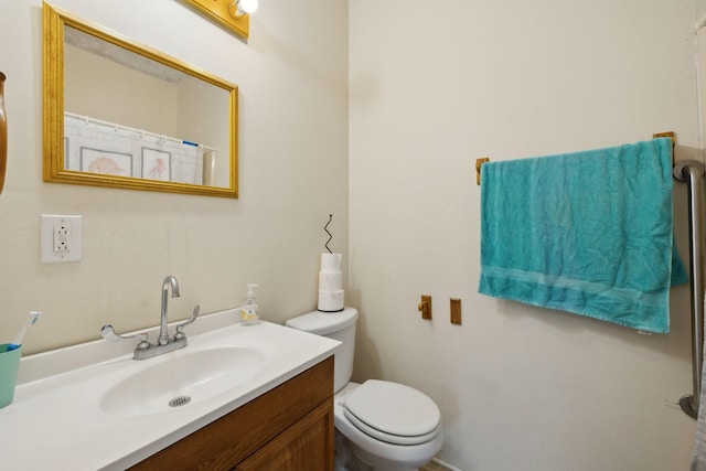 full bathroom featuring toilet and vanity