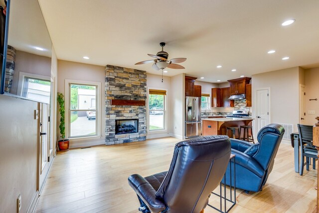 1545 Gravel Hill Rd, Columbia, TN 38401 - living area featuring recessed lighting, ceiling fan, a stone fireplace, and light wood-style flooring