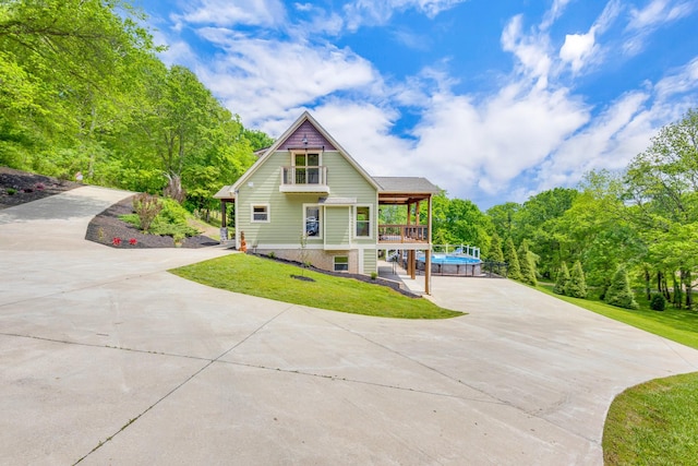 1545 Gravel Hill Rd, Columbia, TN 38401 - back of house featuring a lawn, driveway, and an outdoor pool